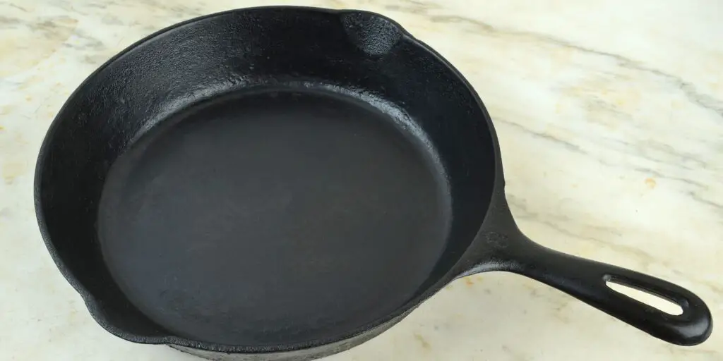 a photo of a properly seasoned cast iron pan